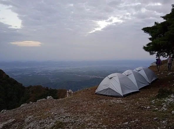 Tents on ridge with valley view