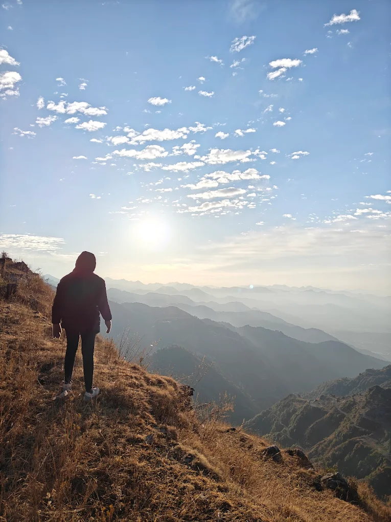 Walking on ridge at sunset