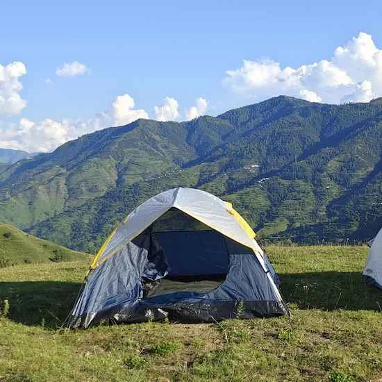 Tent with green mountains